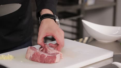 chef preparing raw pork