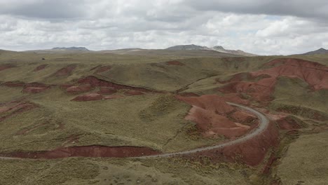 aerial view of red mountains and cloudy sky at peruvian highlands