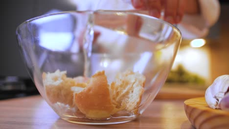 pouring-water-on-a-roll-in-a-bowl