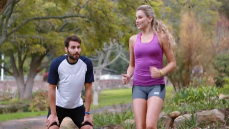 couple warming up in forest