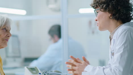 elderly female patient talking with doctor