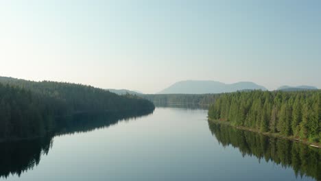 Aerial-of-Mountain-Lake-at-Sunset-Rising-Up-and-Moving-Forward