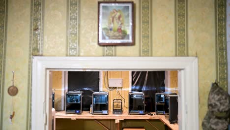 a makeshift ukrainian workshop is revealed, housing a printer farm. these machines mass-produce components for fpv drones, showcasing rapid, low-cost wartime innovation against russia