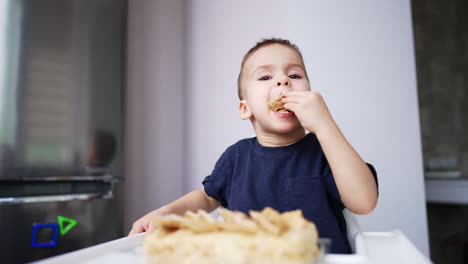little kid eating a tasty cake using no hands. sweet tooth toddler enjoying dessert at home.