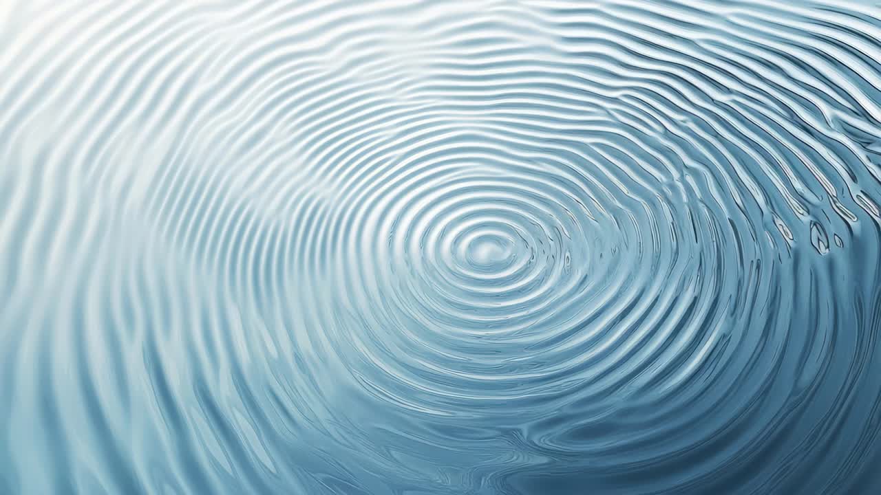A mesmerizing top-down video shot of rippling water, capturing concentric circles in a serene