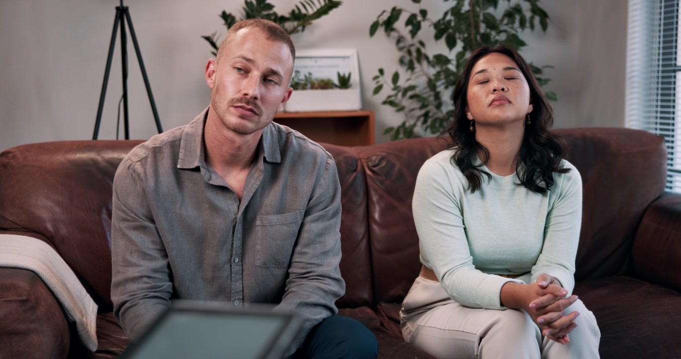 Couple Sitting on Couch During Therapy Session