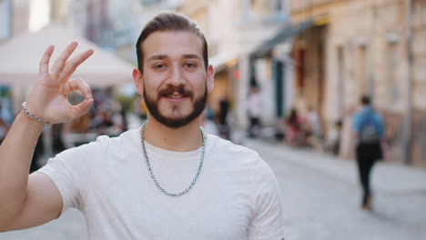 happy cheerful man guy showing ok gesture positive like sign approve something good celebrate