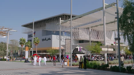 dubai expo 2020 pavilion view. people walk through dubai expo 2020 with the german pavilion in the background