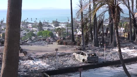 the destroyed remains of a vast apartment complex and charred vehicles overlooking the city of ventura following the 2017 thomas fire 3