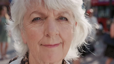 slow motion portrait of happy mature old woman smiling