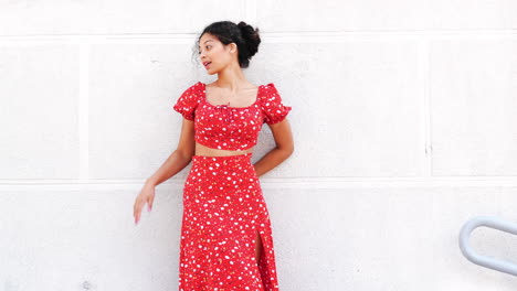 happy woman in floral red outfit