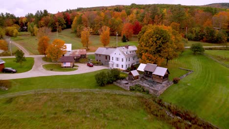 fast aerial push to vermont farm scene in fall