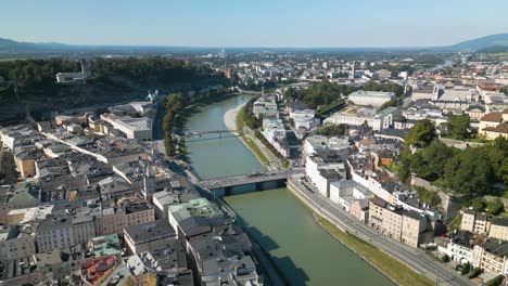 beautiful drone shot above salzach river in salzburg, austria on typical day