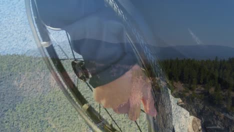 animación de superposición del paisaje sobre el hombre en silla de ruedas al aire libre
