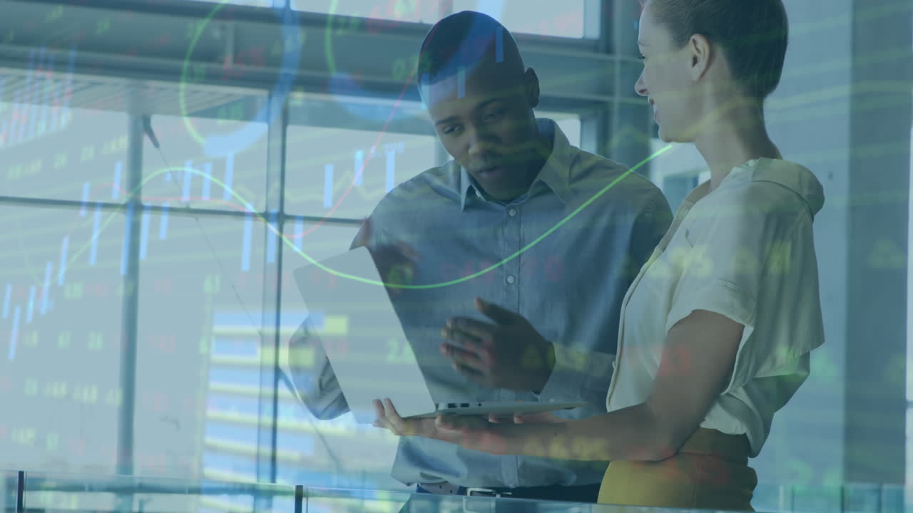 Animation of statistical data processing over diverse man and woman discussing over laptop at office