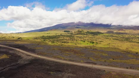 Drone-Shot-of-Flying-Over-Sparse-Vegetation-Approaching-the-Slopes-of-Mauna-Kea-Volcano---Big-Island-Hawaii