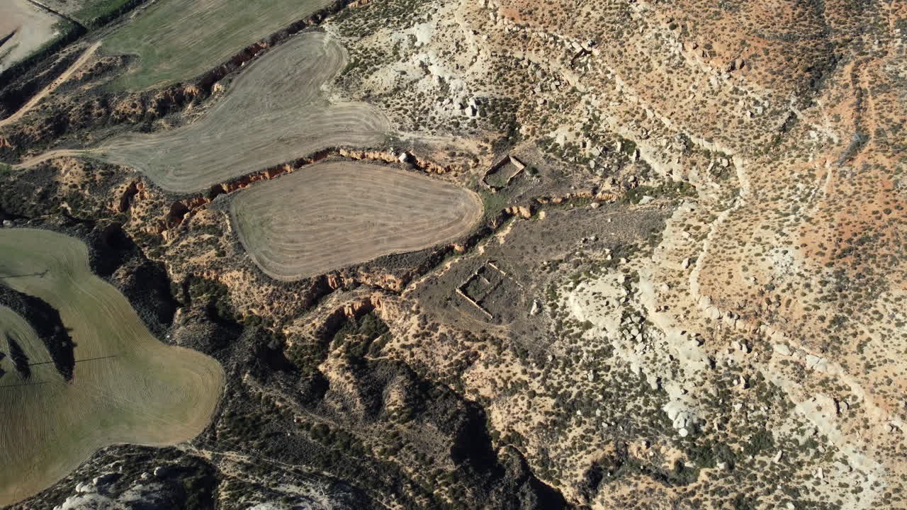 Aerial view of a dry valley with agricultural fields