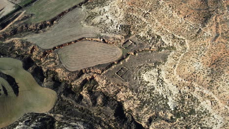 aerial view of a dry valley with agricultural fields