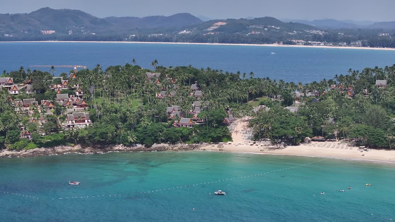 Huts and palm trees, tropical paradise vacation in Thailand. Drone panorama. Phuket