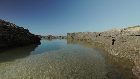 rock pool on beach on tropical island