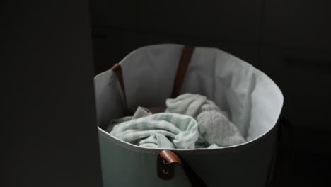 Dirty-clothes-thrown-In-Laundry-Basket-bag,-close-up-view
