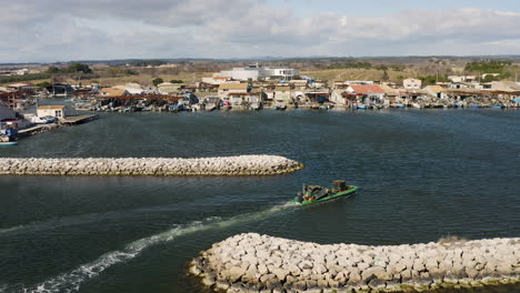 Oyster-Farmers-navigating-in-the-largest-shellfish-port-of-France.-Aerial-drone