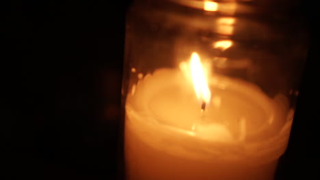 candle into glass