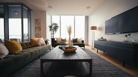 wide push in shot inside of a home living room showing a coffee table, 2 couches, and a tv