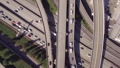 overhead aerial of american commuters in freeway traffic on sunny day