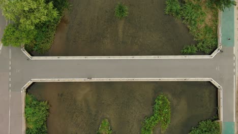 A-footbridge-over-a-stream,-Korea