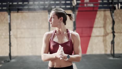 woman preparing for workout in gym