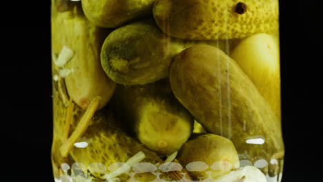 pickled cucumbers in a jar