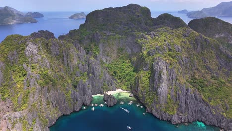 impressive aerial perspective of the secret lagoon at jiji's beach, miniloc island, philippines