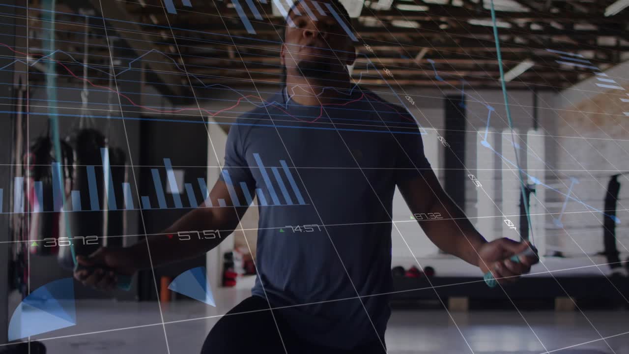 Male trainer skipping rope in gym, camera rising, HUD charts showing cadence for fitness