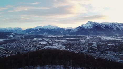 salzburg cityscape with mountain alps on background, high aerial shot, day