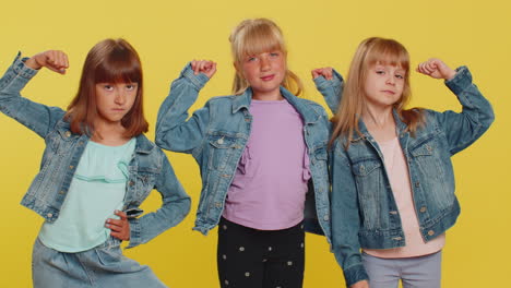 three girls siblings friends showing biceps, feeling power strength success win, healthy lifestyle