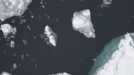 Broken-Pieces-of-Ice-in-Cold-Arctic-Sea,-Bow-of-Boat-POV,-Close-Up