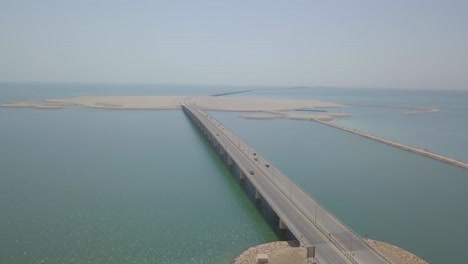 saudi bahrain bridge with cars and trucks