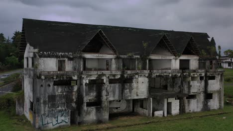 aerial shot of terrifying house in ruins