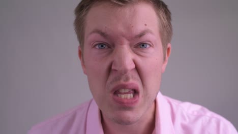 young handsome businessman with pink shirt