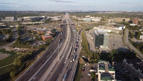 drone push in shot of a busy highway 3 lanes 1 way