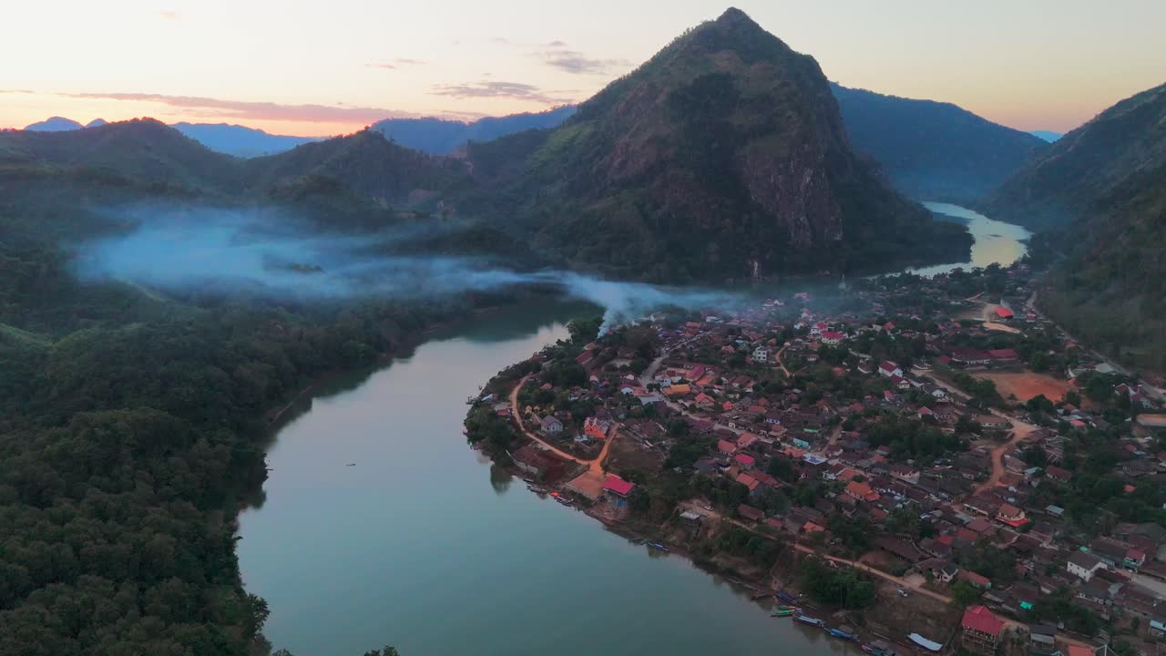 Aerial view of Nong Khiaw Village in Laos, village around misty mountain river