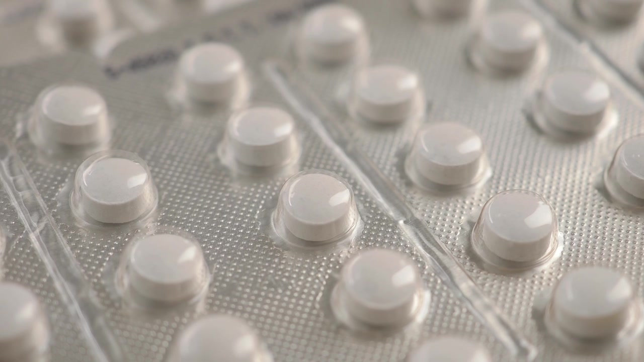 Close-up of White Pills in Blister Packs