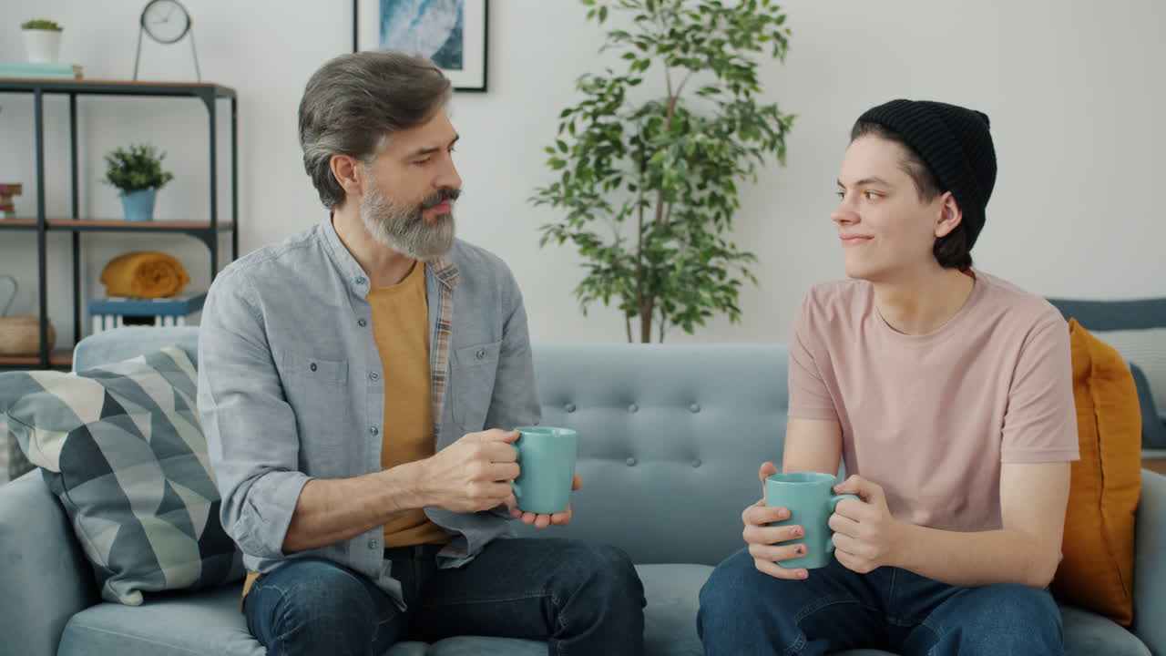 Father and Son Discussing Over a Cup of Coffee