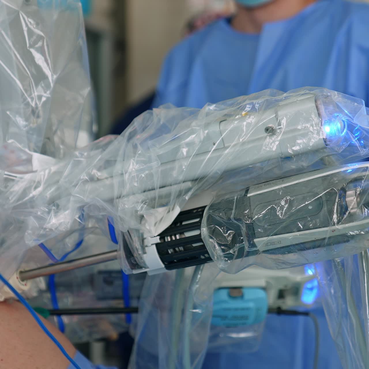 Minimal invasion operation conducted by advanced equipment. Robotic arms move in the little cuts of patient's body