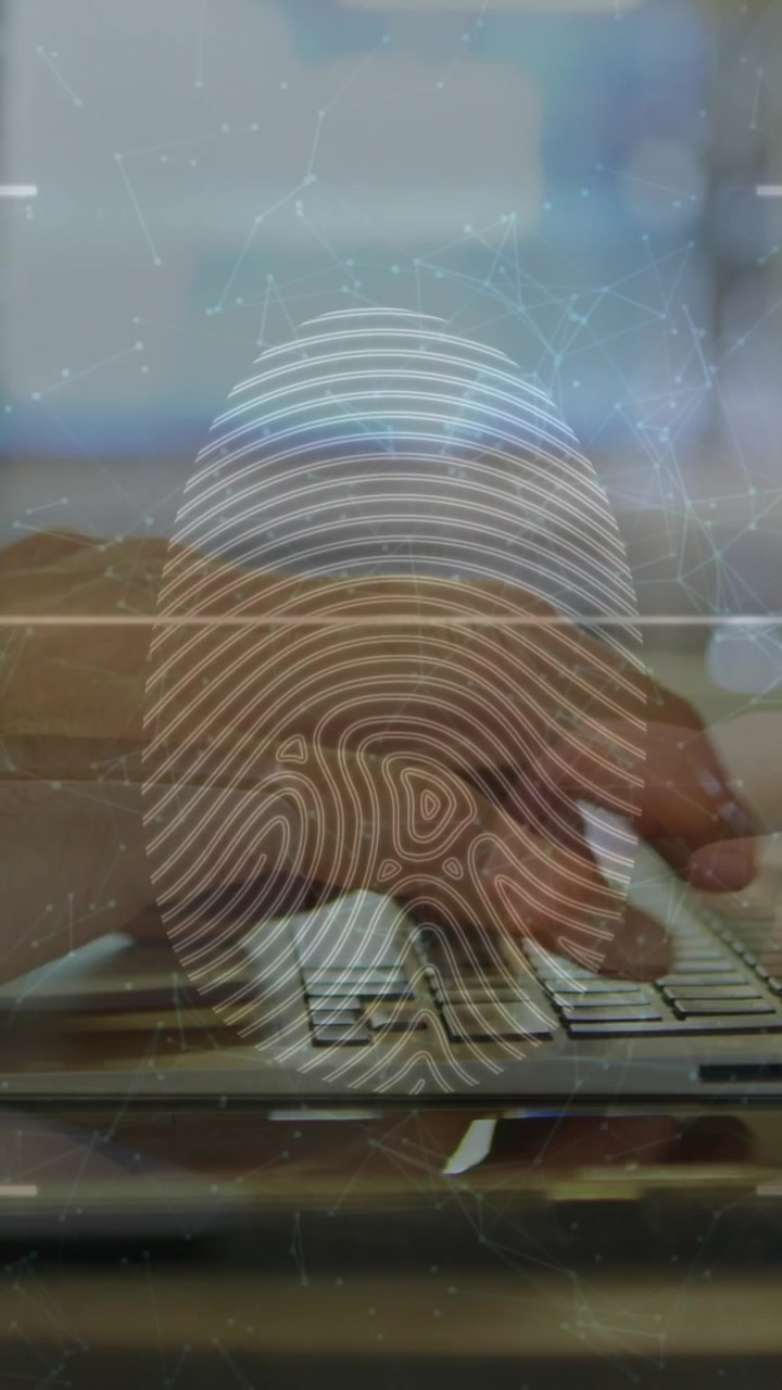 Animation of fingerprint and connected dots over cropped hands of caucasian man using laptop