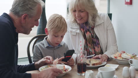 Family enjoying meal together at restaurant