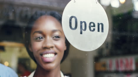 small business owner turning over open sign