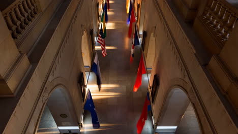 hallway with international flags and sunlit rays