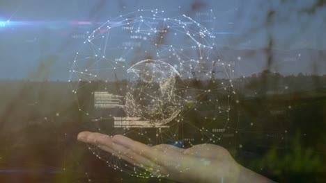 floating digital globe above open hand, projecting 3d network spheres and data fragments